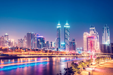 Beautiful incredible cityscape with skyscrapers in the old town next to the Tolerance bridge near the water canal in Dubai, United Arab Emirates.のeditorial素材