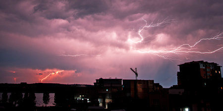 Spooky landscape with a lightning discharge over the city