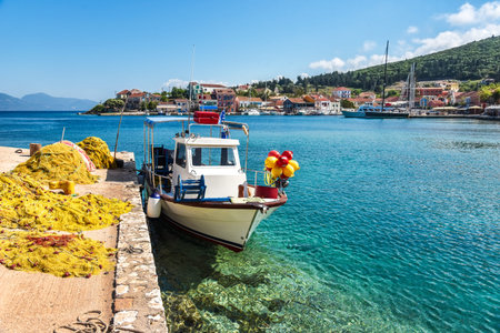 Beautiful scenic landscape with a boat on the embankment in Nydri, Lefkada, Greece. Stunning amazing charming places.の写真素材