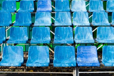 Empty blue rows of seats in the stadium.