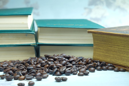 coffee beans in the background of a closed bookの写真素材