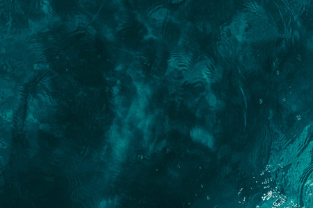 Blue water surface with ripples. Abstract background and texture for design.