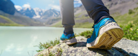 Hiking boots on a mountain peak. Hiking in the mountains