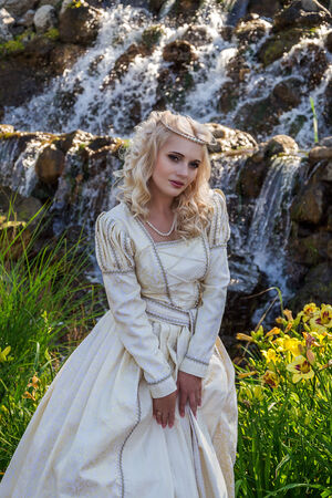  Beautiful woman in vintage dress on natureの写真素材
