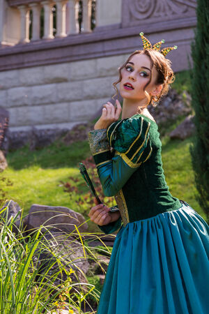  Beautiful woman in vintage dress on natureの写真素材
