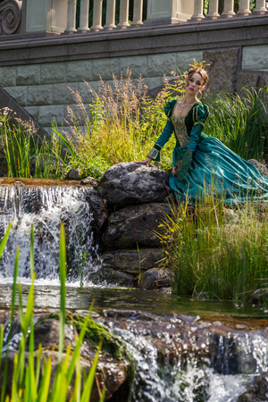  Beautiful woman in vintage dress on natureの写真素材