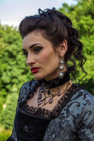 Beautiful woman in vintage dress on natureの写真素材