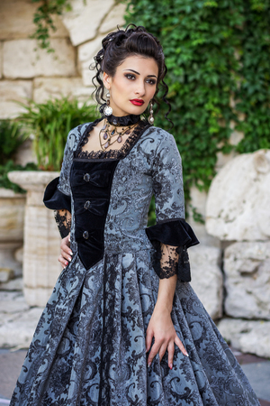 Beautiful woman in vintage dress on natureの写真素材