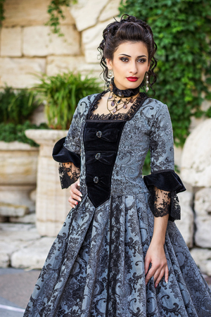 Beautiful woman in vintage dress on natureの写真素材