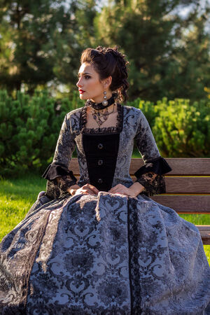 Beautiful woman in vintage dress on natureの写真素材