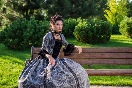 Beautiful woman in vintage dress on natureの写真素材