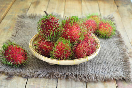 Rambutan Asian Fruit On Bamboo Basket.の写真素材