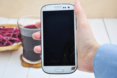 hand showing cell phone.の写真素材