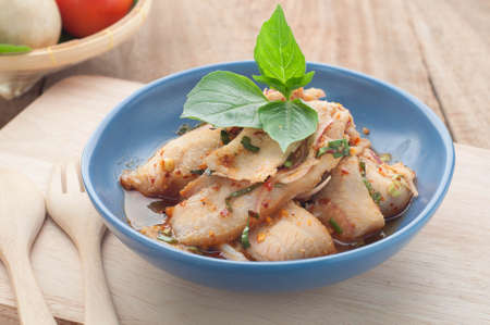Spicy minced pork salad on the plate and vegetables, Thai food.の写真素材