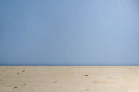 Office Table floor and blue cement background.