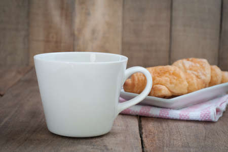 glasses of coffee and dessert on wood floors.の写真素材