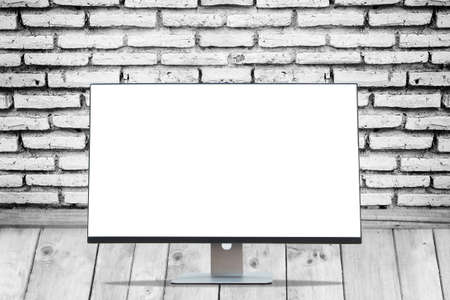 Blank space Display monitor on wood floors and black and white brick wall texture.の写真素材