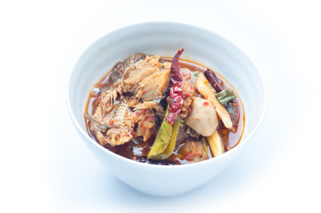 Sour and Spicy Smoked dried Fish Soup on white background, The national cuisine of Thailand.の写真素材