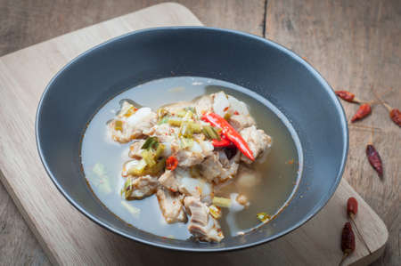 Pork Spare Ribs Spicy Soup on wood floors, The national cuisine of Thailand.の写真素材