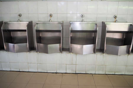 Urinal at public filling station in Thailand.の写真素材
