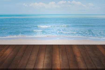 montage of old wood shelf on blurry blue sea background, concept of product shelf on natural landscape.の写真素材