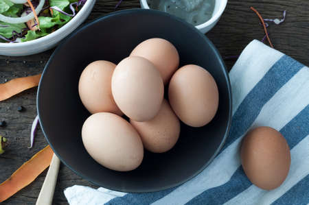 kitchen table with eggs on basket, focus from top view kitchen table.の写真素材