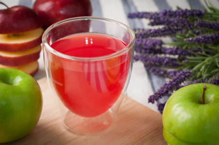 kitchen table with glass of apple juice,  lavender flower  - healthy eating and dieting food, concept of health care lifestyle.の写真素材