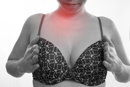 young woman in sexy bras touching Breast on isolated white background , concept of Health check...