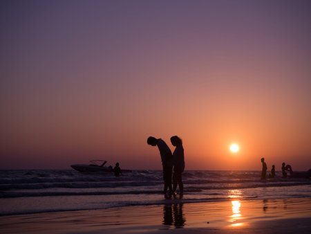 CHONBURI- April 23 : silhouette shadow of couple in love walking on beach with sunset. concept of holiday beach., holiday in Thailand on April 23, 2017 in Chonburi, Thailand.の写真素材