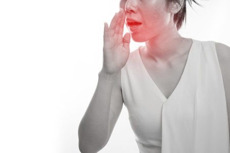 Young asian woman having Bad breath on isolated white background, concept of health care lifestyle.