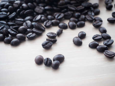 wood kitchen table with closeup of fresh coffee bean.の写真素材