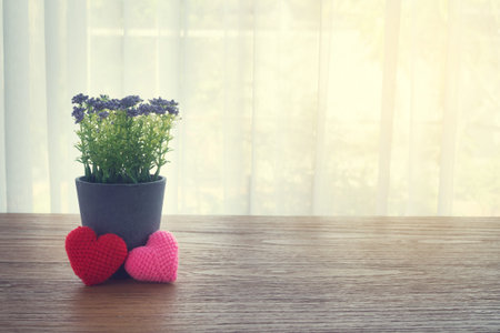 Wood Office table with Beautiful Couple knitted fabric heart shape, Purple garden flower pot on...