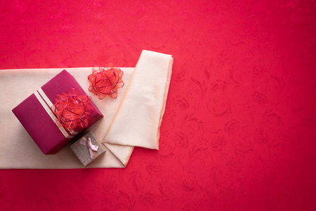 Gift box with Copy space for text on red texture background, concept of Chinese new year background....