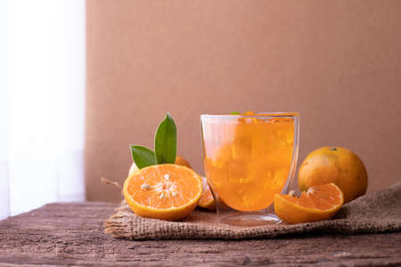 Cold Orange juice and Sliced orange on wood table, top table.の写真素材