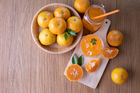 Cold Orange juice and Sliced orange on wood table, top table.