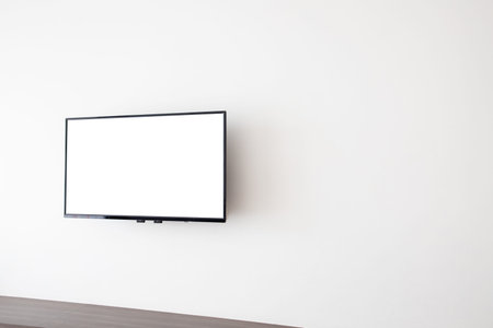 blank screen television on concrete wall at living room. copy space for text on TV.の写真素材