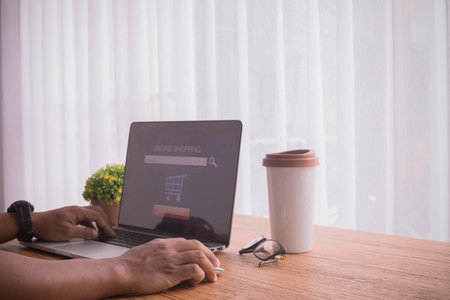businessman using laptop, concept of online shopping, toptable.
