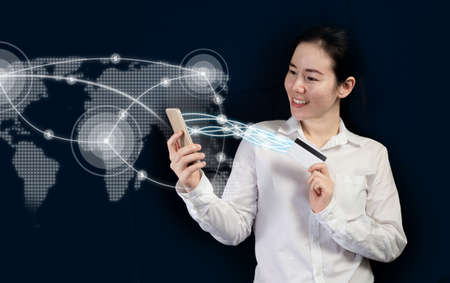 businesswoman using phone transfer money with mobile application, internet banking as concept, trendy girl.の写真素材