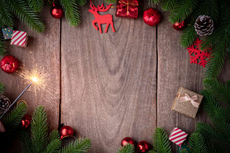 Christmas background with decorations and firework on wooden board, view from above wooden board.の写真素材