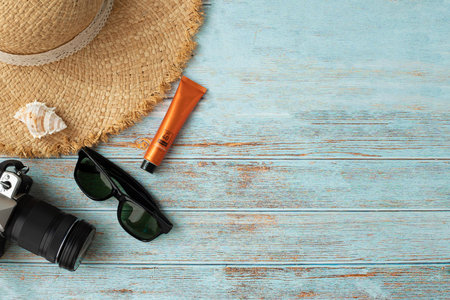 Traveller accessories in summer on wood table.