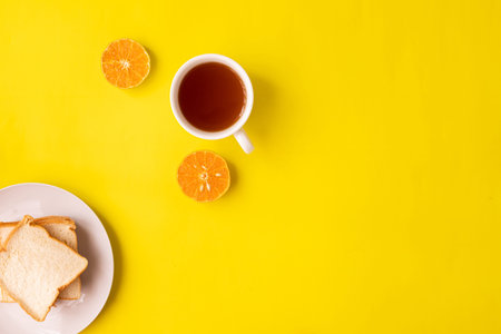 Cup of tea on yellow background.の写真素材