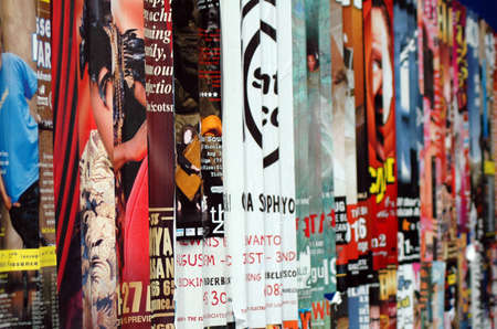 Publicity posters on a street wallのeditorial素材