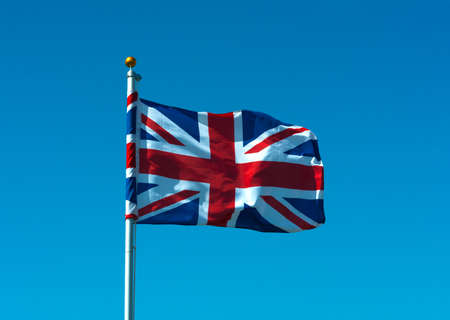 Union flag flying on flagpoleの写真素材