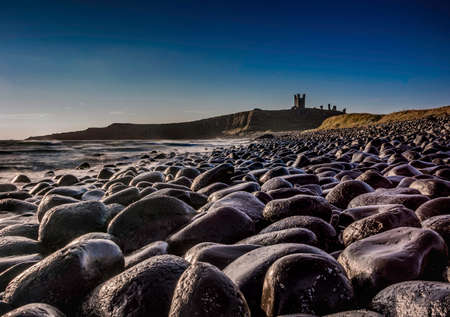 Bolder field leading to Castle on a sunny morningの写真素材