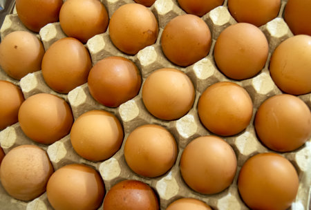 Fresh brown chicken eggs in a paper package