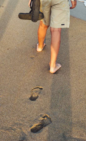 Footprints in the wet sandの写真素材