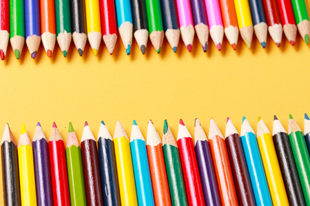 a row of colored pencils in a lineの写真素材