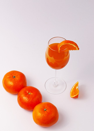 orange juice and oranges  with white backgroundの写真素材