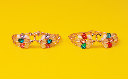 Ornamental unusual rings set in a yellow backgroundの写真素材