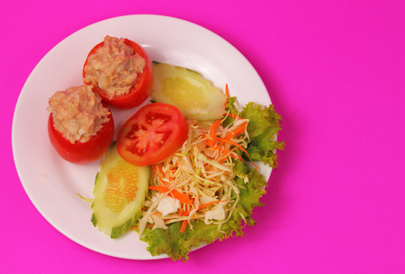 tuna salad dish with a pink backgroundの写真素材